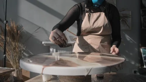 Process of creating an abstract painting using brown epoxy resin is a unique Stock Footage 277281712