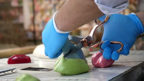 The process of creating caramel candies and lollipops in a modern confectionery. Stock Footage 330522173