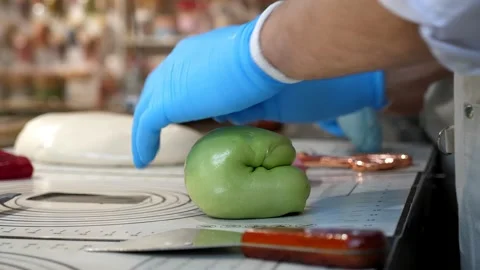 The process of creating caramel candies and lollipops in a modern confectionery. Stock Footage 330869750