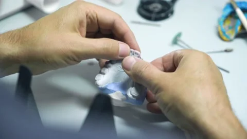The process of creating a dental crown and impression by a dental technician Stock Footage 205509053