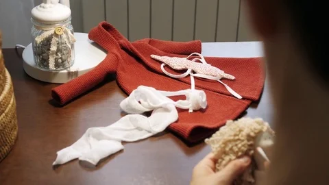 Process of creating a doll: master draws a toy cheeks. Close-up. Stock Footage 81619570