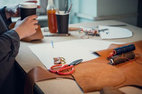 The process of creating elements of individual shoes made of genuine leather Stock Photos