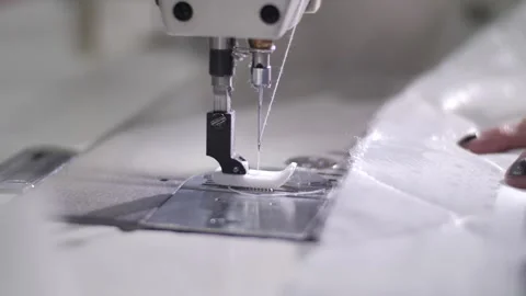 The process of creating from fabric in an electric sewing machine Stock Footage 240757456