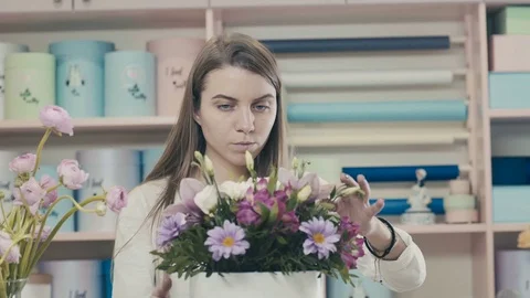 The process of creating a floral composition. Flower composition Stock Footage 73488351
