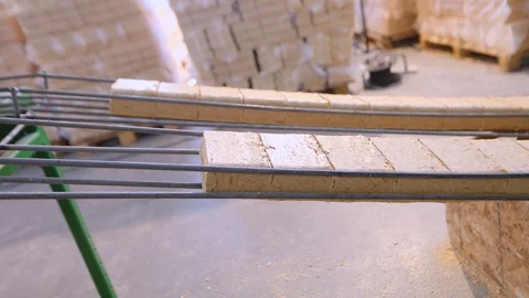 The process of creating fuel briquettes, the production of compressed sawdust Stock Footage 106843932