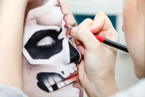 The process of creating makeup for Halloween Stock Photos