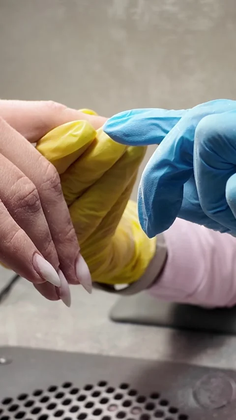 Process of creating a manicure. Cosmetic manicure. Cuticle removal. Stock Footage 276504537