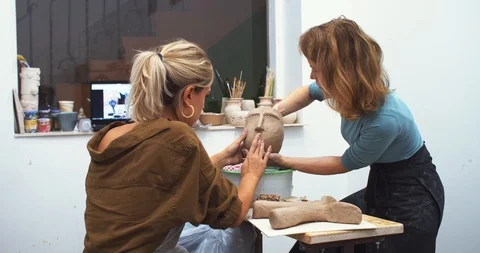 The process of creating modern interior flowerpot vase with surprised human face Stock Footage 120210875