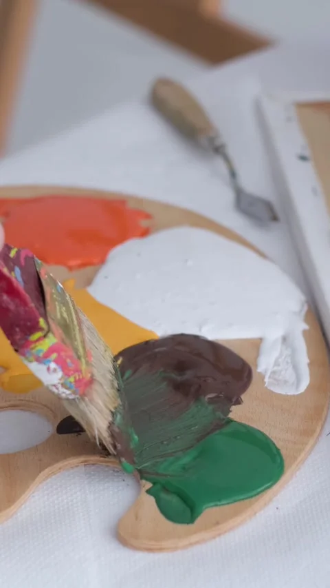 The process of creating an oil painting in the workshop by a professional artist Stock Footage 248375907