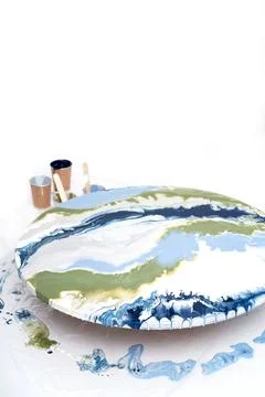 The process of creating a painting using fluid art technique. Foto stock