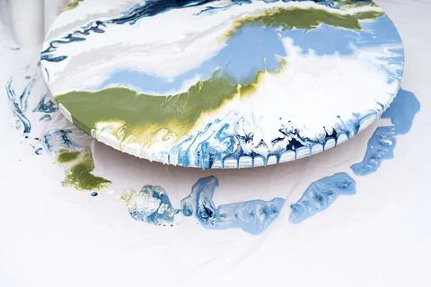 The process of creating a painting using fluid art technique. Stock Photos