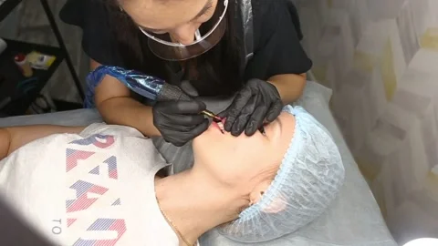 The process of creating permanent lip makeup. Stock Footage 160141641