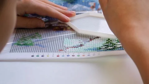 The process of creating a picture of rhinestones, mosaic. Stock Footage 168624282