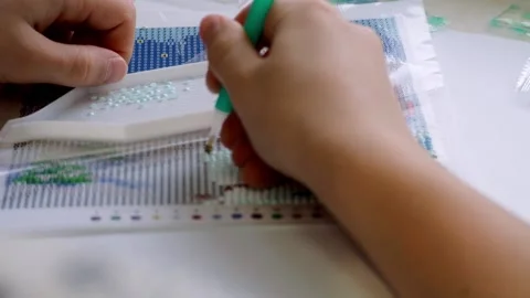The process of creating a picture of rhinestones, mosaic. Stock Footage 168624283