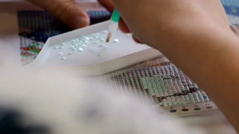The process of creating a picture of rhinestones, mosaic. Stock Footage 168624286