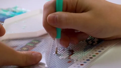 The process of creating a picture of rhinestones, mosaic. Stock Footage 168624291
