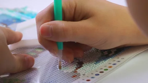 The process of creating a picture of rhinestones, mosaic. Stock Footage 168624299