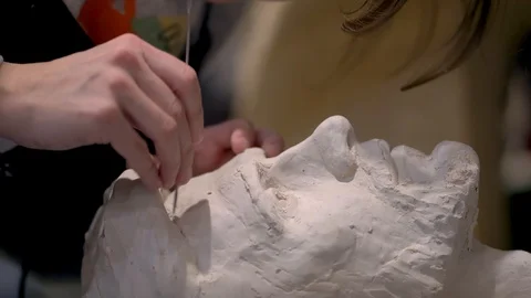 The process of creating sculpture. The sculptor is working. Stock Footage 126772043