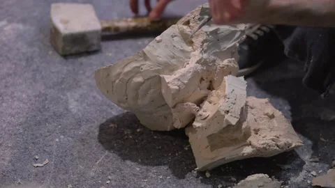 The process of creating sculpture. The sculptor is working. Stock Footage 153143911