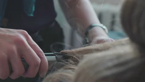 The process of creating styling - voluminous curls. Beauty saloon Stock Footage 74442249