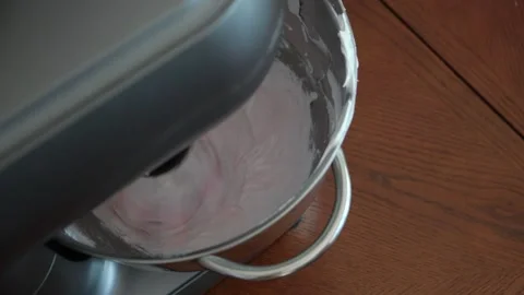 Process of creating sweet dessert by planetary mixer on white cream with a food Stock Footage 149026000