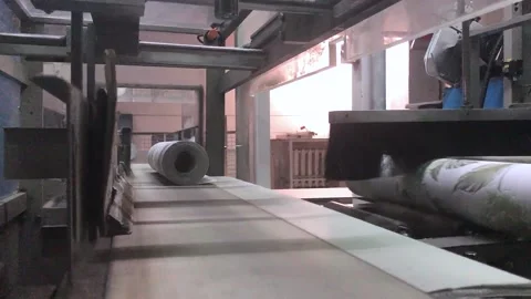The process of creating wallpaper. Automated wallpaper production factory Stock Footage 203970609