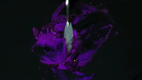 Process of creating watercolor using palette knife and pigment, black background Stock Footage 138802254