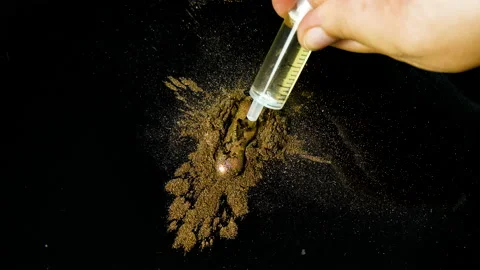 Process of creating watercolor using palette knife and pigment, black background Stock Footage 138803051