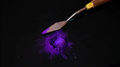 Process of creating watercolor using palette knife and pigment, black background Stock Footage 138803080