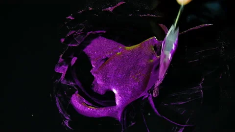 Process of creating watercolor using palette knife and pigment, black background Stock Footage 138804092