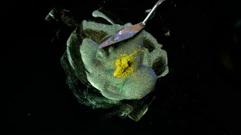 Process of creating watercolor using palette knife and pigment, black background Stock Footage 138804267