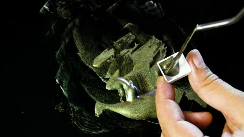 Process of creating watercolor using palette knife and pigment, black background Stock Footage 138804470