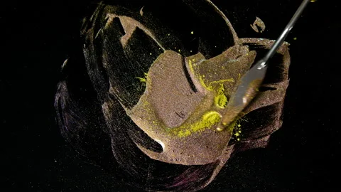 Process of creating watercolor using palette knife and pigment, black background Stock Footage 138806649