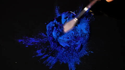 Process of creating watercolor using palette knife and pigment, black background Stock Footage 138807868