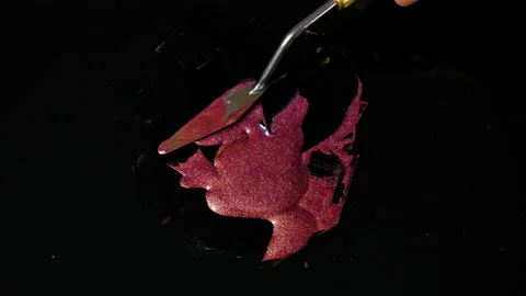 Process of creating watercolor using palette knife and pigment, black background Stock Footage 138808269