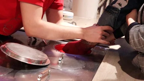 Process of creating a wax sculpture of a couple holding hands. Popular souven Stock Footage 129395235