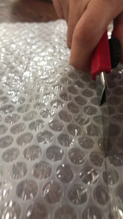 The Process Cutting Bubble Pack Plastic Close Up Slow Motion Video Stock Footage 337720528