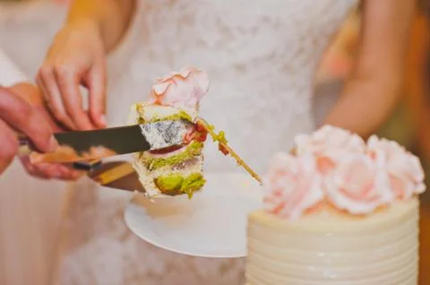 The process of cutting the cake to share for guests 7787. Stock Photos