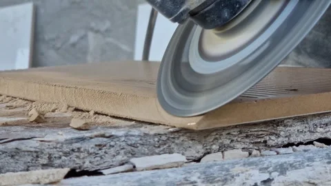 The process of cutting ceramic tiles with an angle grinder Stock Footage 344170145