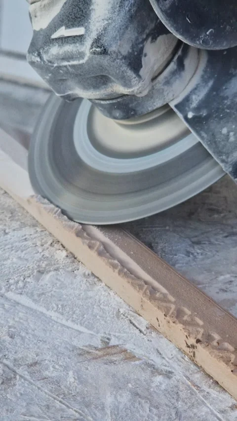 The process of cutting ceramic tiles with an angle grinder close-up Stock-Footage 346775256