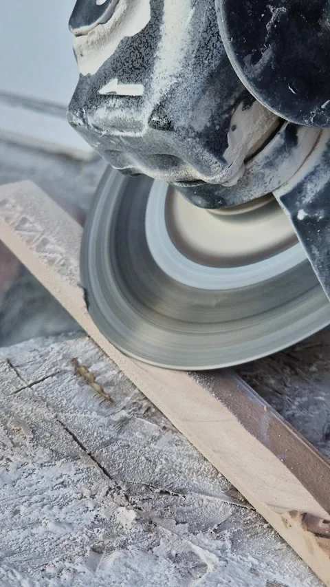 The process of cutting ceramic tiles with an angle grinder Stock Footage 346775258