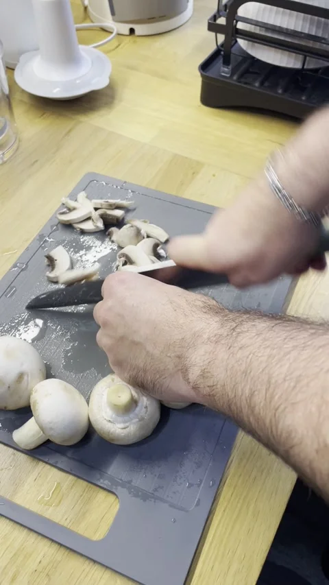 The process of cutting champignon mushrooms Video stock 329422867