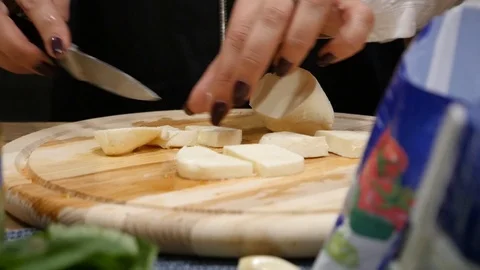 Process of cutting the cheese on a cutting board close-up Stock Footage 101546214