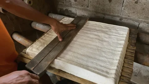 The process of cutting the chilled tofu dough into several pieces Stock Footage 309374051