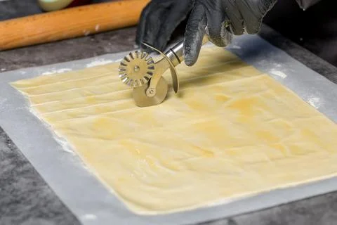 Process of cutting dough Fotos de archivo