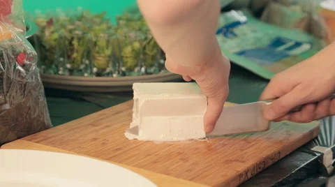 The process of cutting feta cheese by chef Stock Footage 54456906