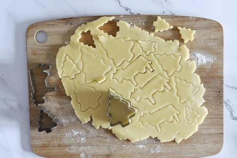 The process of cutting figures from shortcrust pastry for Christmas cookies Stock Photos