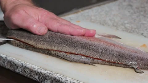 The process of cutting the fish trout. Cooking at home. Stock Footage 221852827