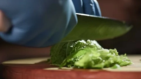 Process of cutting fresh green salat lettuce with a knife 스톡 동영상 149079466