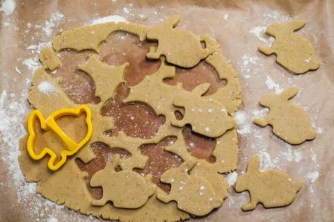 Process of cutting gingerbread cookies in the form of a rabbit Stock Photos